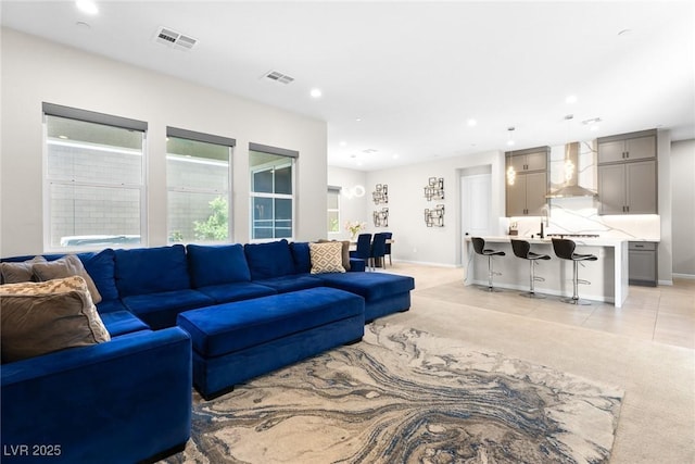 8929 Cassia Winds St, Las Vegas, NV 89166 - living room featuring light colored carpet, recessed lighting, and baseboards