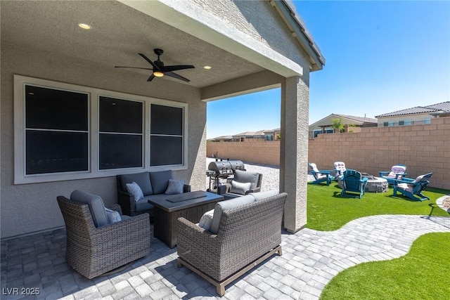 8929 Cassia Winds St, Las Vegas, NV 89166 - view of patio / terrace featuring a fenced backyard, an outdoor living space with a fire pit, and a ceiling fan