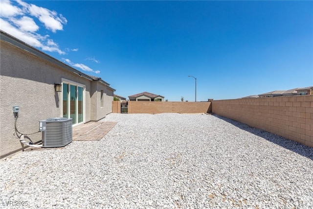 8929 Cassia Winds St, Las Vegas, NV 89166 - fenced backyard featuring central AC unit and a patio
