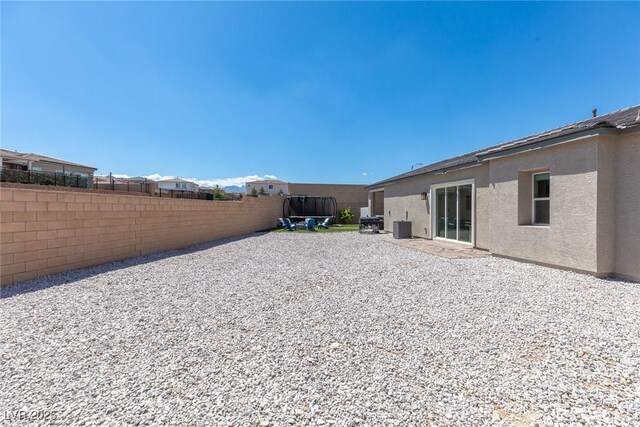 8929 Cassia Winds St, Las Vegas, NV 89166 - back of property with fence, stucco siding, a patio, and central air condition unit