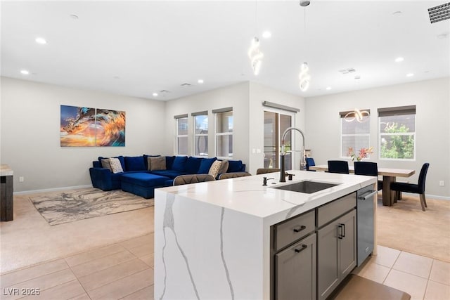 8929 Cassia Winds St, Las Vegas, NV 89166 - kitchen featuring light carpet, a sink, light tile patterned floors, recessed lighting, and baseboards