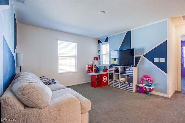 carpeted living area featuring baseboards