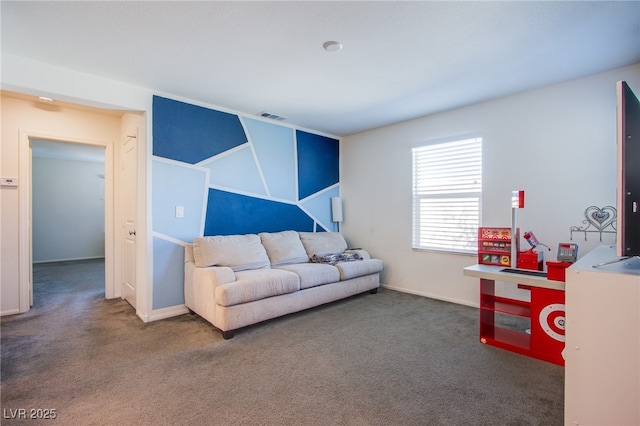 carpeted living area featuring baseboards
