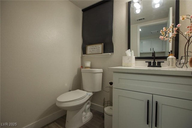 9013 Cypress Point Way, Las Vegas, NV 89117 - bathroom featuring baseboards, wood finished floors, toilet, and vanity