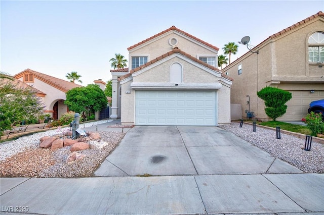 9013 Cypress Point Way, Las Vegas, NV 89117 - mediterranean / spanish house featuring driveway, a tile roof, a garage, and stucco siding