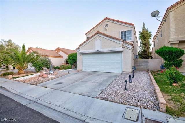 9013 Cypress Point Way, Las Vegas, NV 89117 - view of front of property featuring a tiled roof, concrete driveway, a garage, and stucco siding