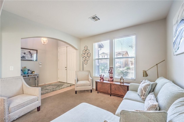 1213 High Altitude Ave, North Las Vegas, NV 89032 - living area with arched walkways, carpet, and baseboards