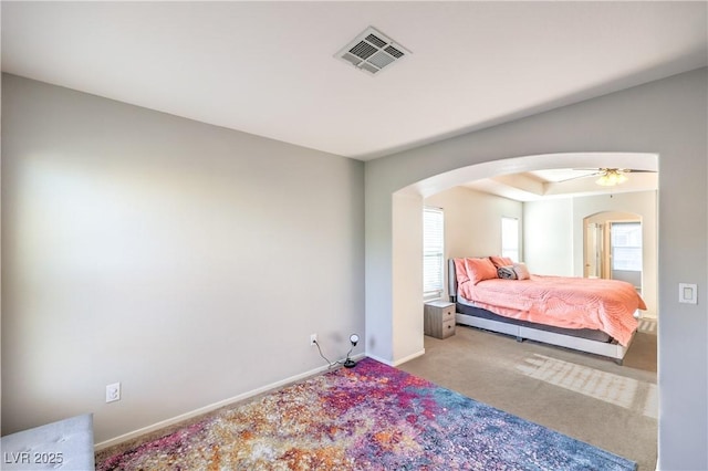 1213 High Altitude Ave, North Las Vegas, NV 89032 - carpeted bedroom featuring arched walkways and baseboards