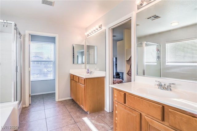 1213 High Altitude Ave, North Las Vegas, NV 89032 - bathroom with a shower stall, tile patterned flooring, two vanities, and baseboards