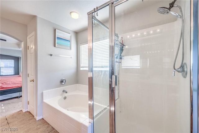 1213 High Altitude Ave, North Las Vegas, NV 89032 - ensuite bathroom with a shower stall, a bath, and tile patterned floors