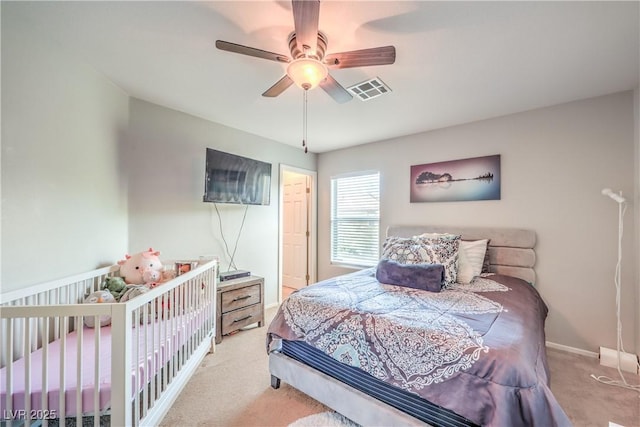 1213 High Altitude Ave, North Las Vegas, NV 89032 - carpeted bedroom with a ceiling fan and baseboards