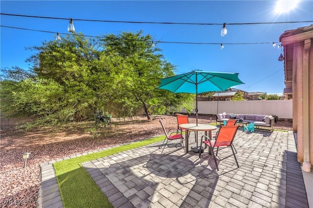 1213 High Altitude Ave, North Las Vegas, NV 89032 - view of patio / terrace featuring fence, outdoor lounge area, and outdoor dining space