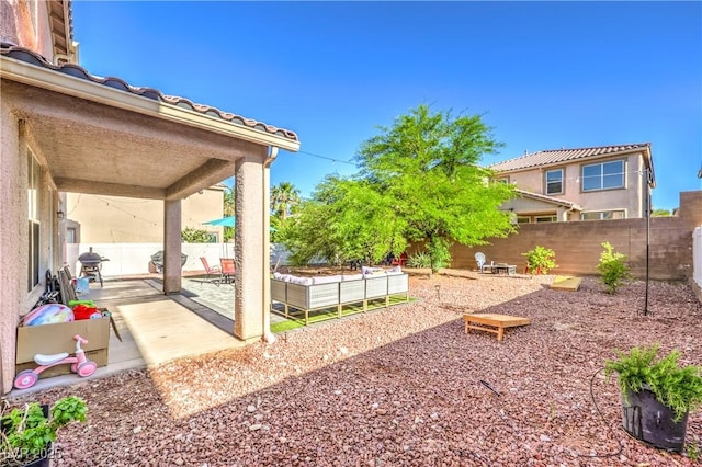 1213 High Altitude Ave, North Las Vegas, NV 89032 - fenced backyard featuring a patio area and a garden