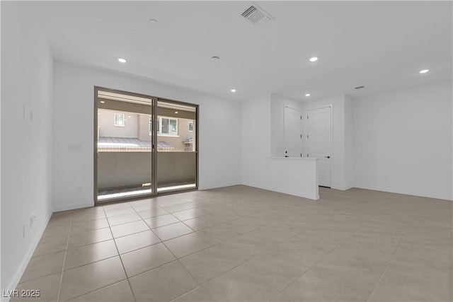 unfurnished room with recessed lighting, tile patterned floors, and baseboards