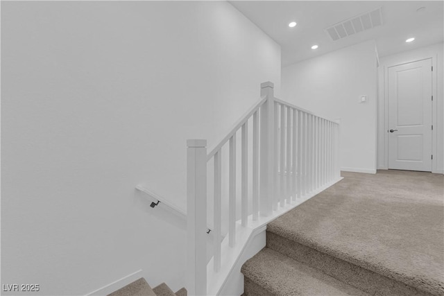 staircase with carpet flooring, recessed lighting, and baseboards