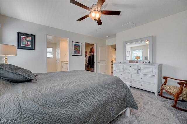 387 Larksong Ave, Henderson, NV 89011 - bedroom with carpet flooring, a walk in closet, a ceiling fan, connected bathroom, and a closet