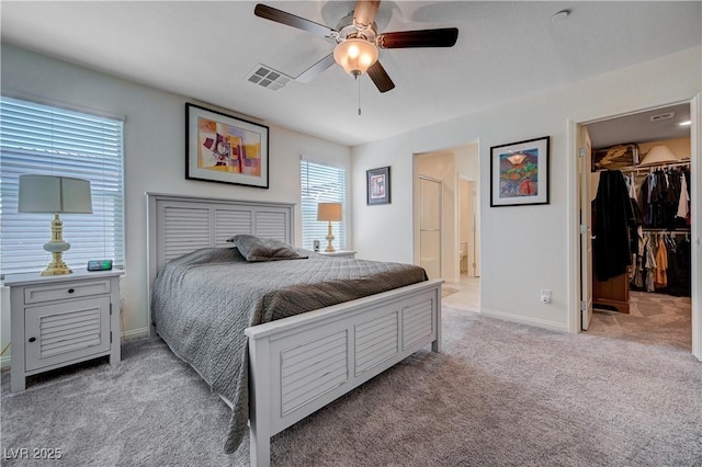 387 Larksong Ave, Henderson, NV 89011 - bedroom featuring carpet, a spacious closet, a closet, ensuite bathroom, and a ceiling fan
