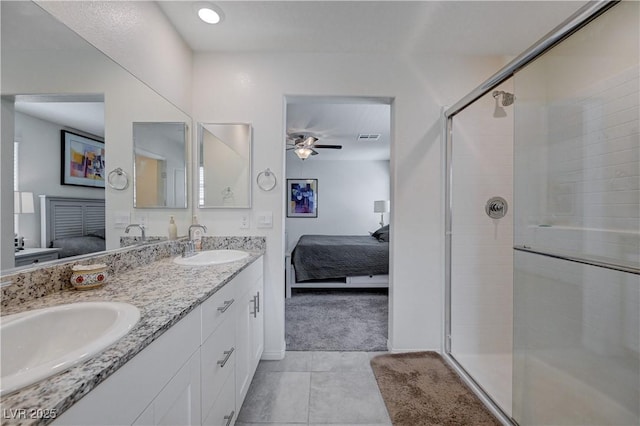 387 Larksong Ave, Henderson, NV 89011 - bathroom featuring connected bathroom, double vanity, tile patterned flooring, and a shower stall
