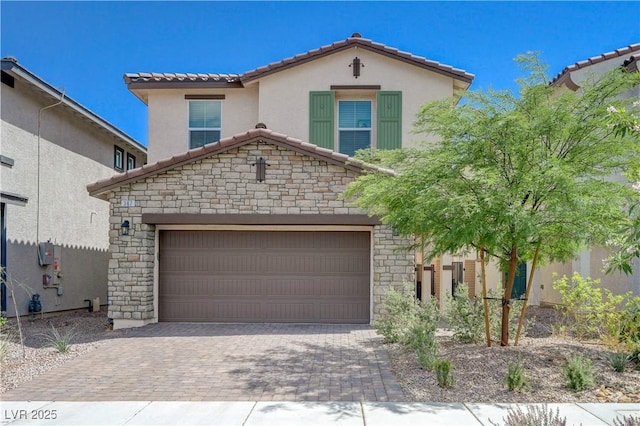 387 Larksong Ave, Henderson, NV 89011 - view of front of property with stone siding, a tiled roof, decorative driveway, stucco siding, and an attached garage