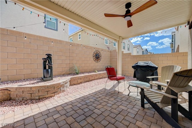 387 Larksong Ave, Henderson, NV 89011 - fenced backyard with a grill, a patio, and ceiling fan