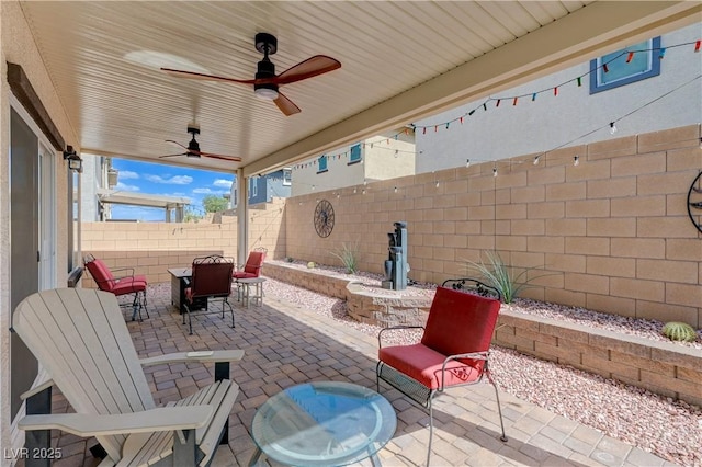 387 Larksong Ave, Henderson, NV 89011 - fenced backyard with outdoor dining area, a patio, and a ceiling fan