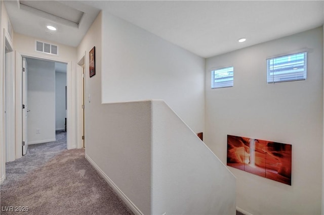 387 Larksong Ave, Henderson, NV 89011 - corridor with an upstairs landing, carpet floors, attic access, recessed lighting, and baseboards