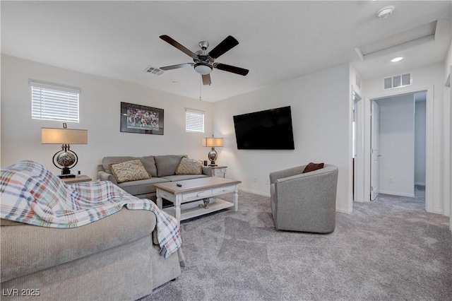 387 Larksong Ave, Henderson, NV 89011 - carpeted living area with attic access, healthy amount of natural light, a ceiling fan, and baseboards