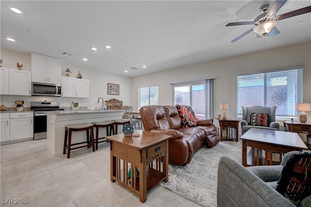 387 Larksong Ave, Henderson, NV 89011 - living area with a ceiling fan, recessed lighting, and light tile patterned floors