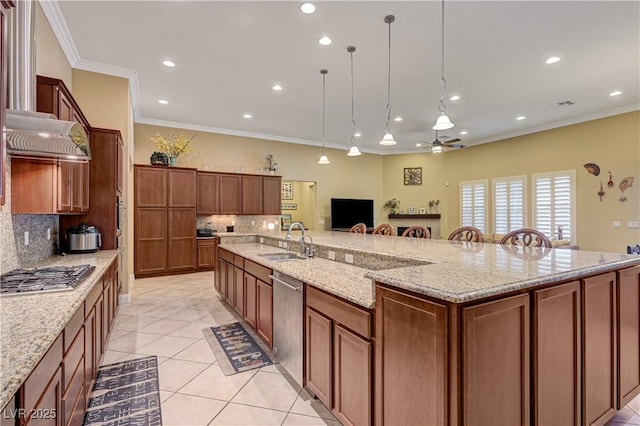 kitchen with stainless steel appliances, a sink, crown molding, decorative backsplash, and light tile patterned flooring
