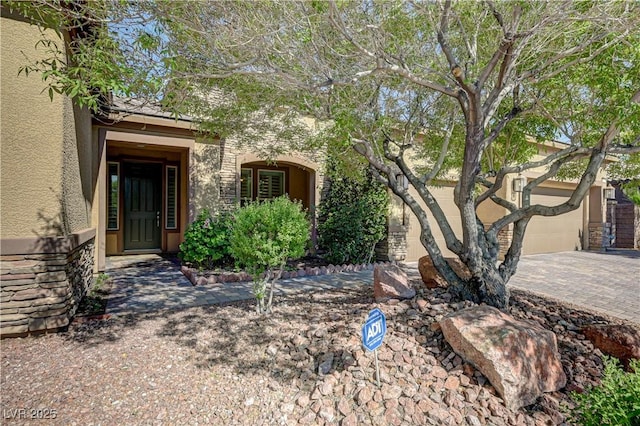 view of front of house featuring driveway and stucco siding