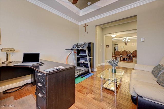 office area with light wood finished floors, a chandelier, crown molding, and baseboards