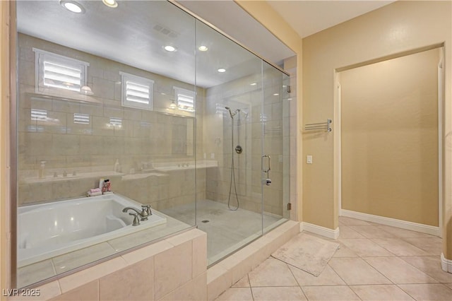 bathroom with a garden tub, a shower stall, tile patterned flooring, baseboards, and recessed lighting