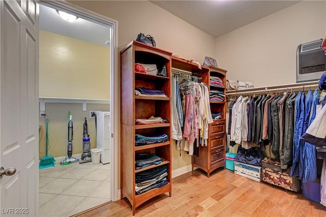 walk in closet featuring light wood-style flooring