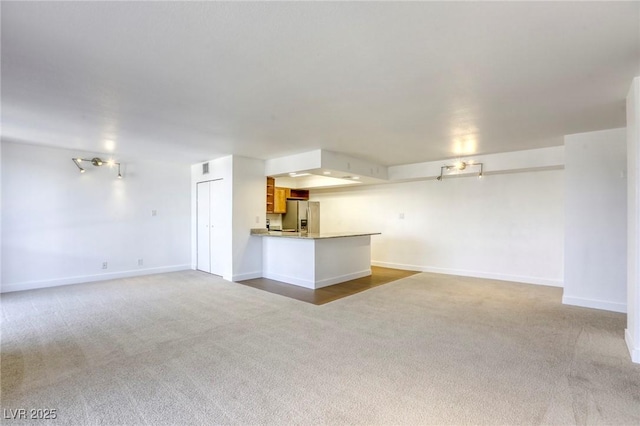 3930 University Center Dr Unit 311, Las Vegas, NV 89119 - unfurnished living room featuring carpet flooring and baseboards