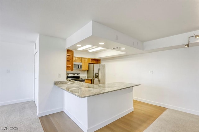 3930 University Center Dr Unit 311, Las Vegas, NV 89119 - kitchen featuring appliances with stainless steel finishes, open shelves, baseboards, brown cabinetry, and recessed lighting
