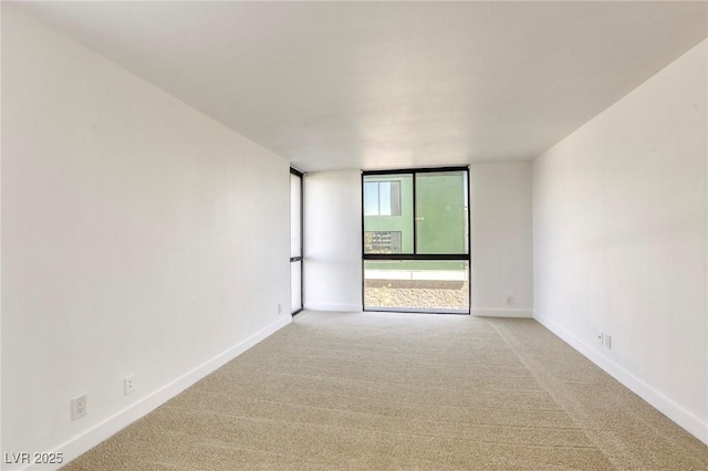 3930 University Center Dr Unit 311, Las Vegas, NV 89119 - unfurnished room with light carpet and baseboards