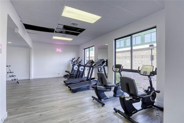 3930 University Center Dr Unit 311, Las Vegas, NV 89119 - gym featuring a paneled ceiling, wood finished floors, and baseboards