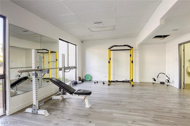 3930 University Center Dr Unit 311, Las Vegas, NV 89119 - exercise room featuring a drop ceiling, wood finished floors, and baseboards