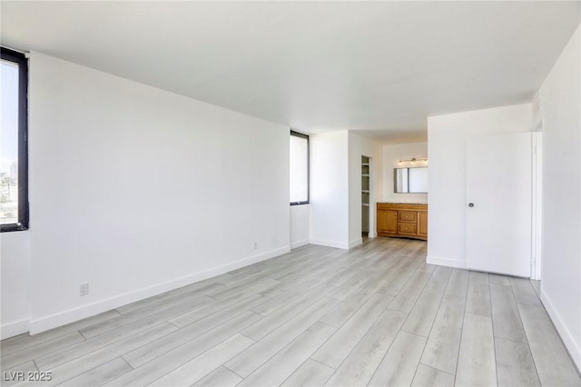 3930 University Center Dr Unit 312, Las Vegas, NV 89119 - spare room with light wood-style floors, healthy amount of natural light, and baseboards