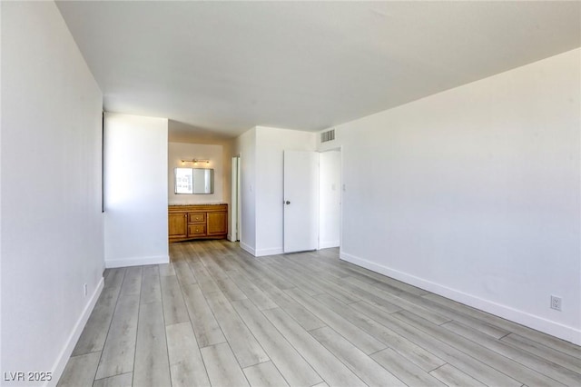 3930 University Center Dr Unit 312, Las Vegas, NV 89119 - spare room featuring light wood finished floors and baseboards