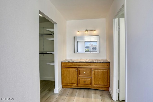 3930 University Center Dr Unit 312, Las Vegas, NV 89119 - bathroom with wood finished floors, vanity, and baseboards