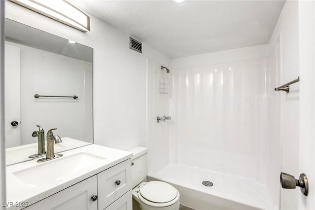 3930 University Center Dr Unit 312, Las Vegas, NV 89119 - bathroom featuring toilet, a shower, and vanity