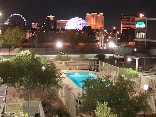 3930 University Center Dr Unit 312, Las Vegas, NV 89119 - pool at twilight featuring fence and a community pool