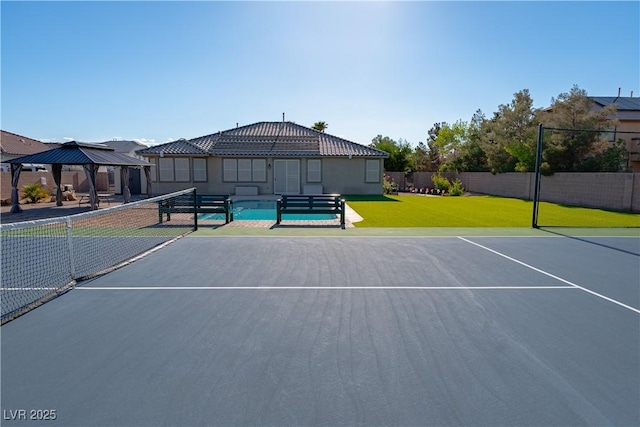 view of tennis court featuring a gazebo