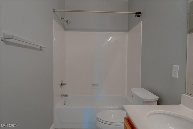 bathroom with toilet, vanity, and shower / bath combination