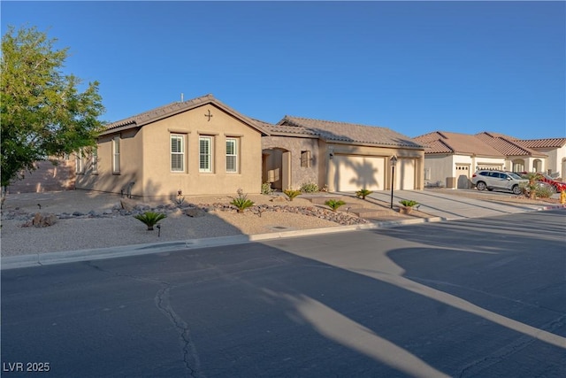 8228 Fulton Ranch St, Las Vegas, NV 89131 - mediterranean / spanish-style house with stucco siding, driveway, an attached garage, and a tile roof