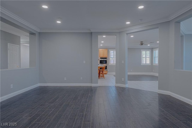 empty room with dark wood-style flooring, crown molding, a ceiling fan, recessed lighting, and baseboards