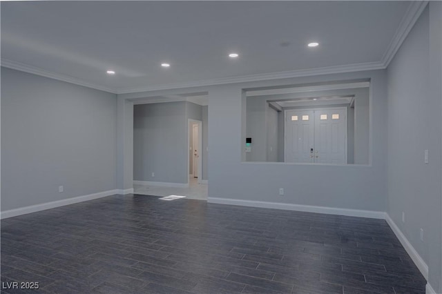 spare room featuring baseboards, wood finished floors, ornamental molding, and recessed lighting