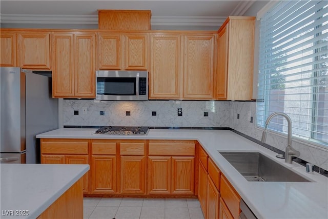 8228 Fulton Ranch St, Las Vegas, NV 89131 - kitchen featuring appliances with stainless steel finishes, crown molding, backsplash, light countertops, and light tile patterned flooring