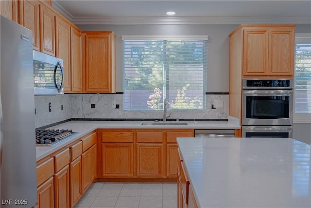8228 Fulton Ranch St, Las Vegas, NV 89131 - kitchen featuring stainless steel appliances, ornamental molding, light countertops, decorative backsplash, and light tile patterned floors